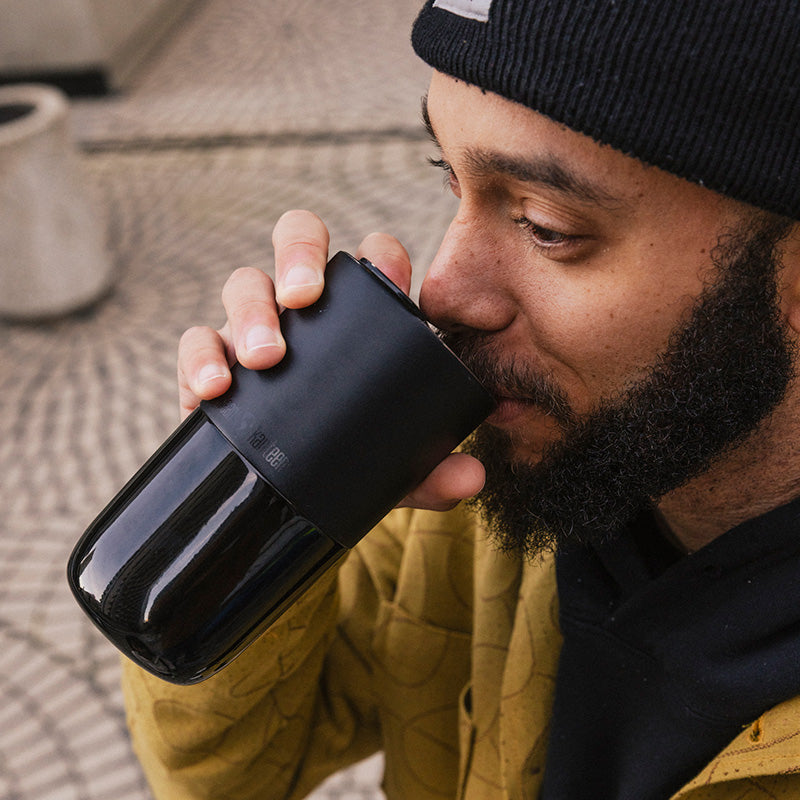 16oz-rise-tumbler-p7 16oz_rise_tumbler_black_man_drink_square.jpg